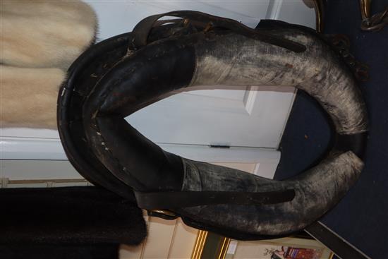 A heavy horse leather collar and brass hames